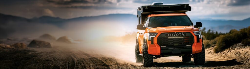 An orange Toyota Tundra in the desert
